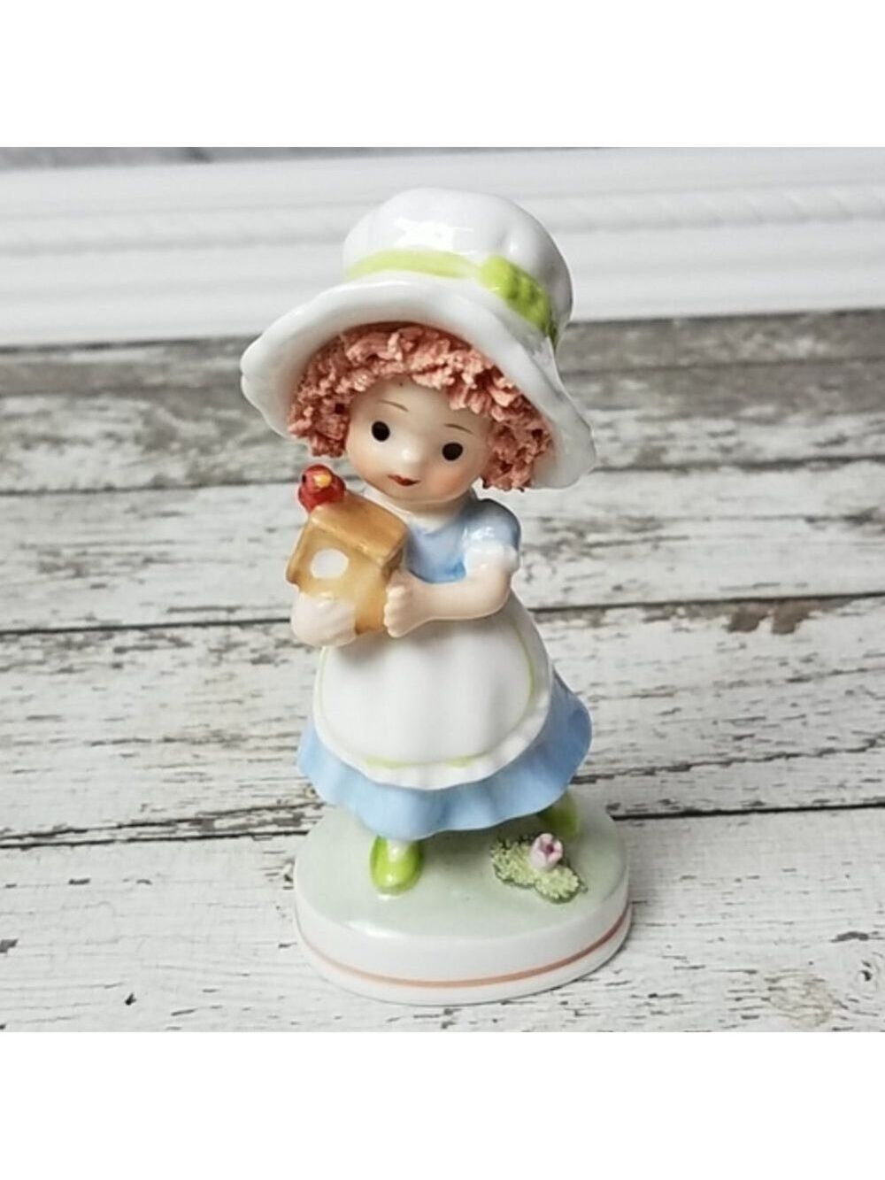 Vintage cute little girl holding birdhouse figurine - Picture 1 of 3